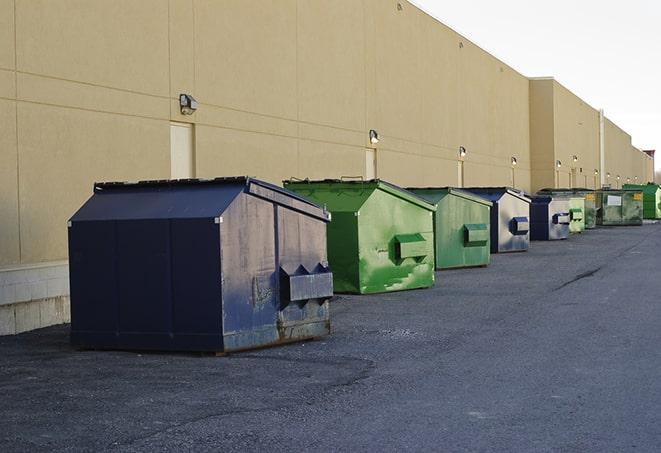 a row of construction dumpsters parked on a jobsite in Graytown